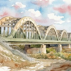 Un puente cruzando un río al atardecer, uniendo dos costas